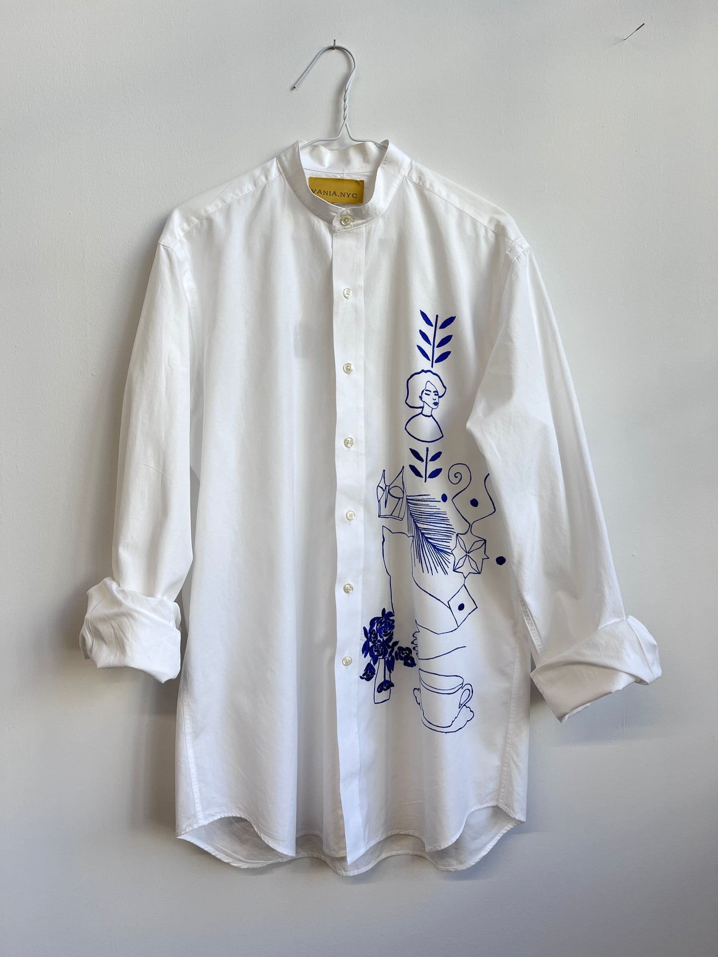Her Universe in Blue embroidered on a white shirt