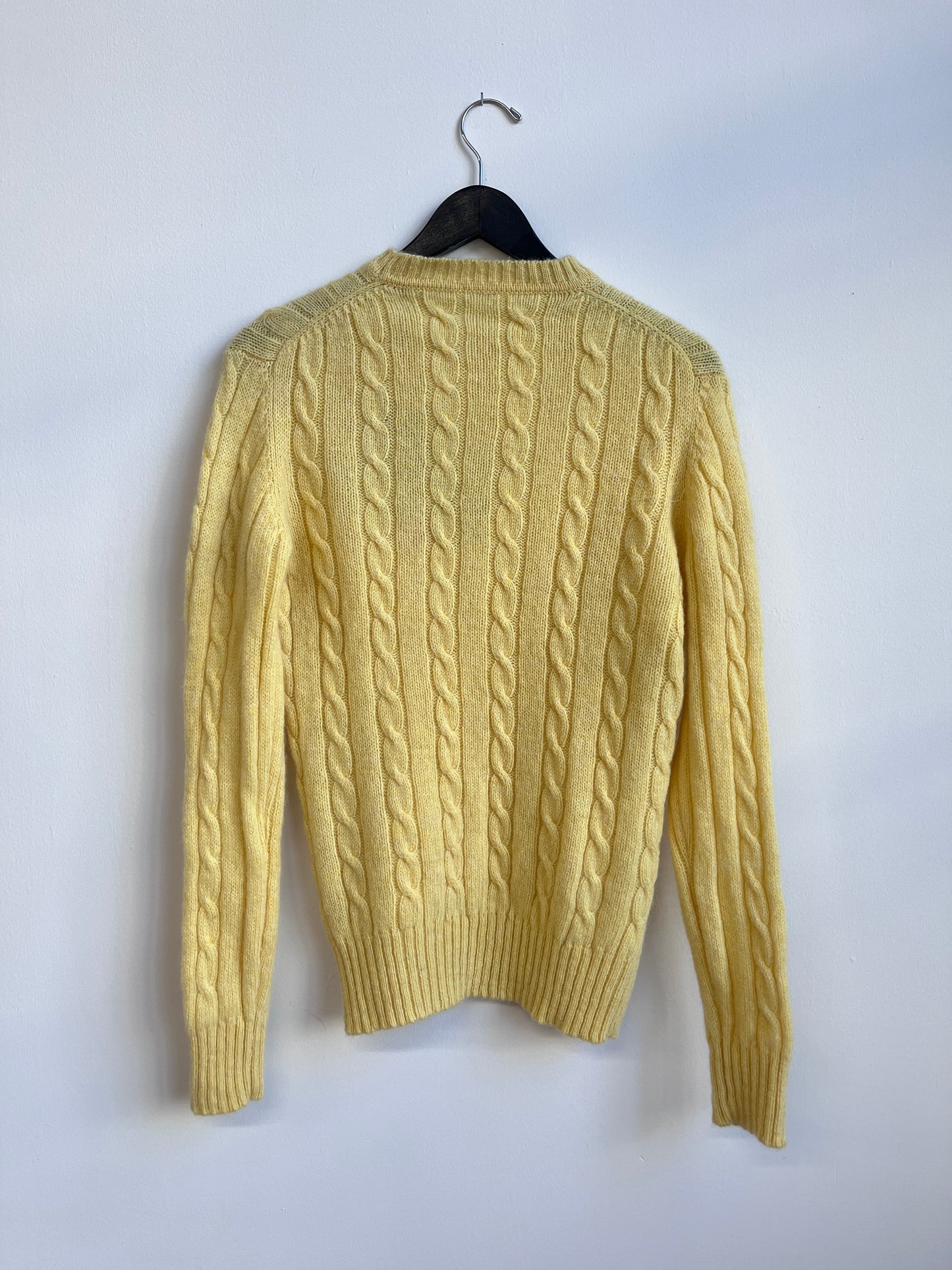 The rose bird on a yellow sweater