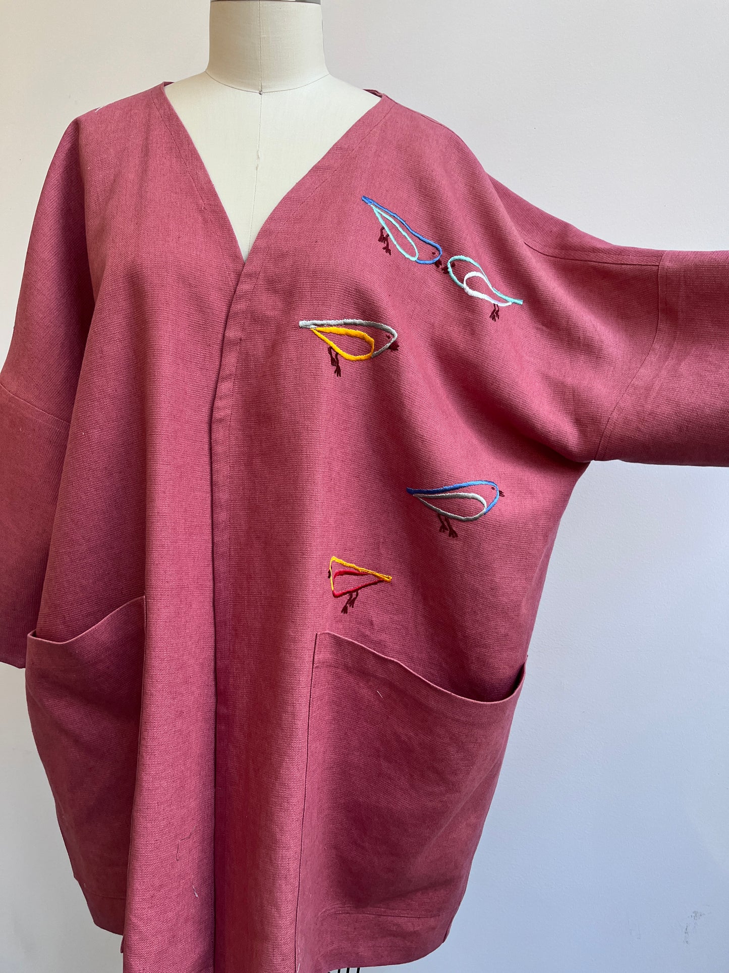 Imaginary Birds embroidered on a Mauve Linen Coat