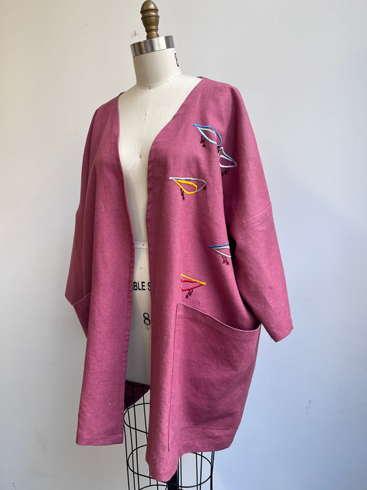 Imaginary Birds embroidered on a Mauve Linen Coat