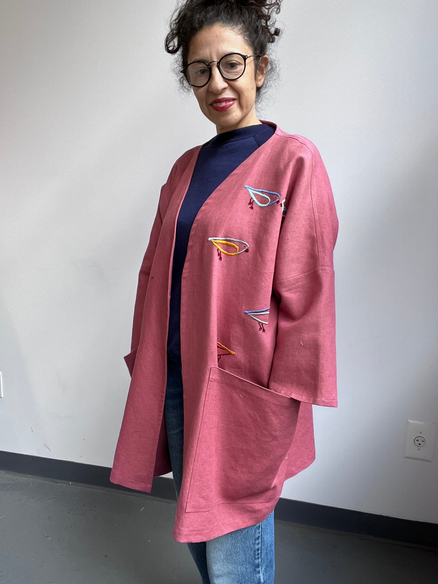 Imaginary Birds embroidered on a Mauve Linen Coat