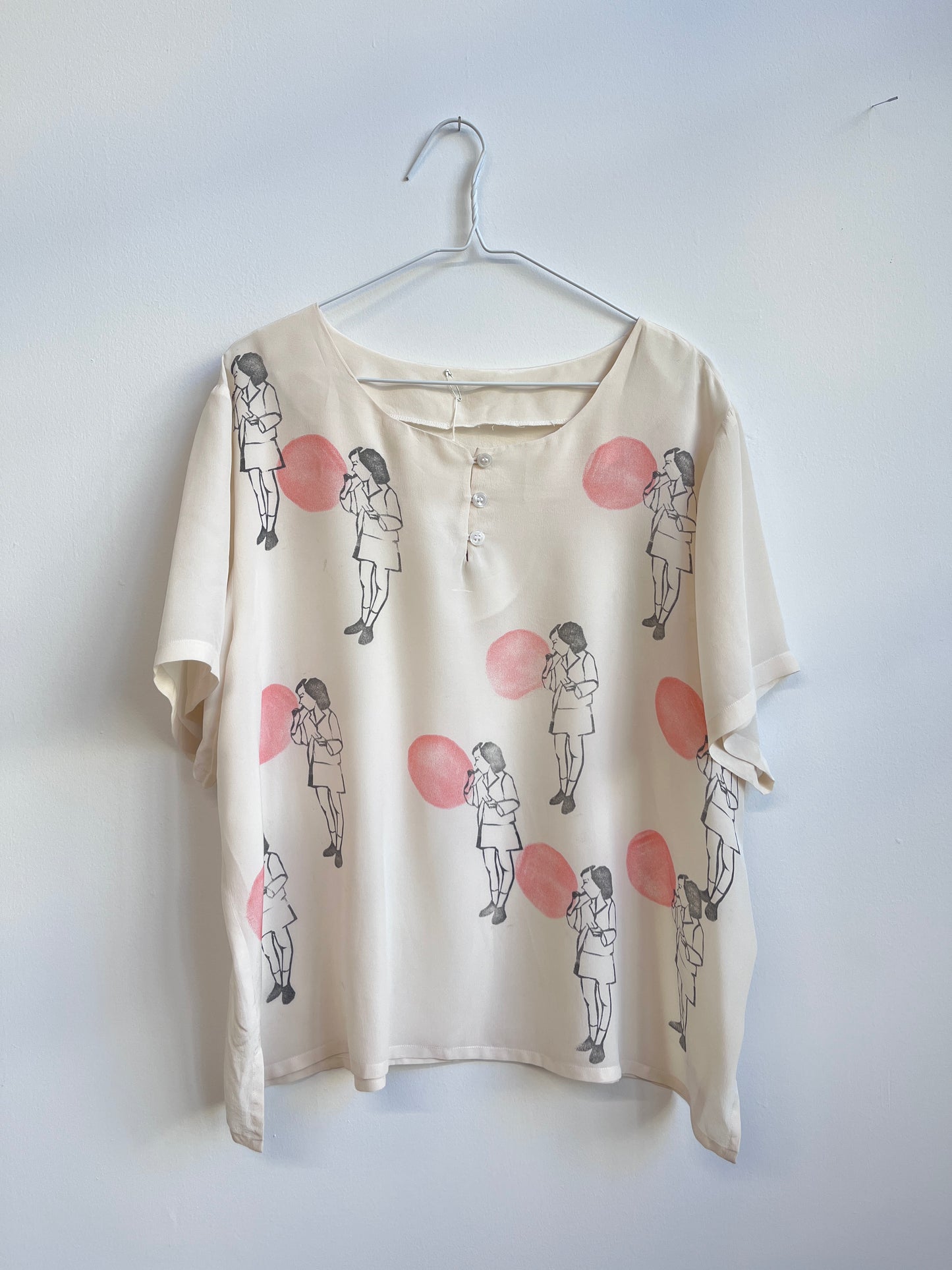 Blowing a Balloon printed on a silk top