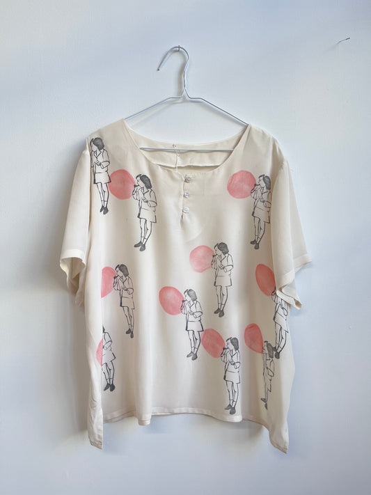 Blowing a Balloon printed on a silk top