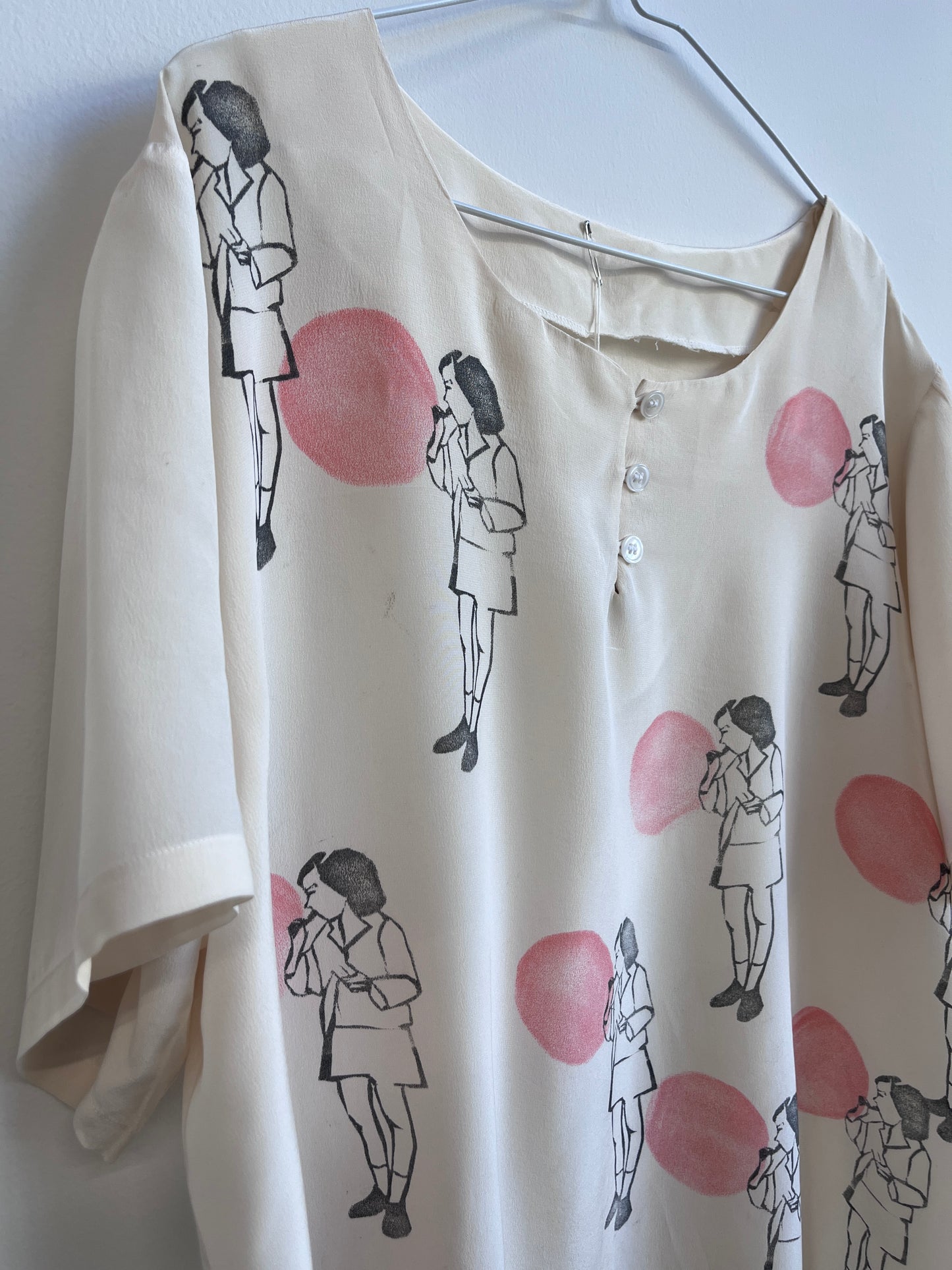 Blowing a Balloon printed on a silk top