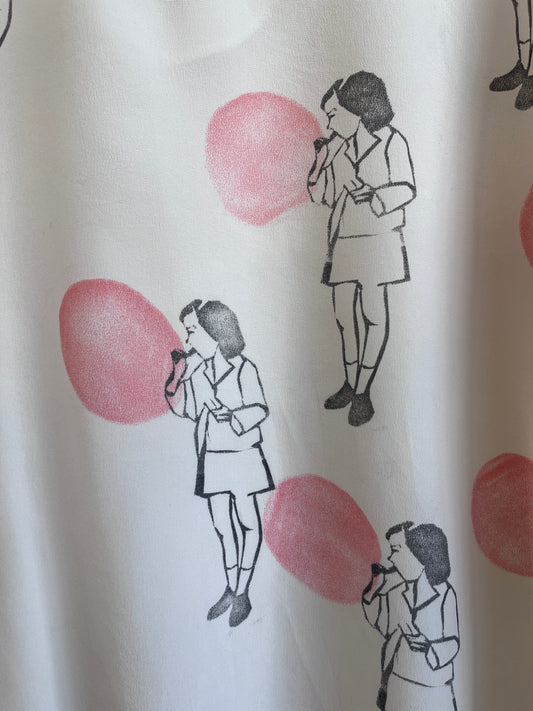 Blowing a Balloon printed on a silk top