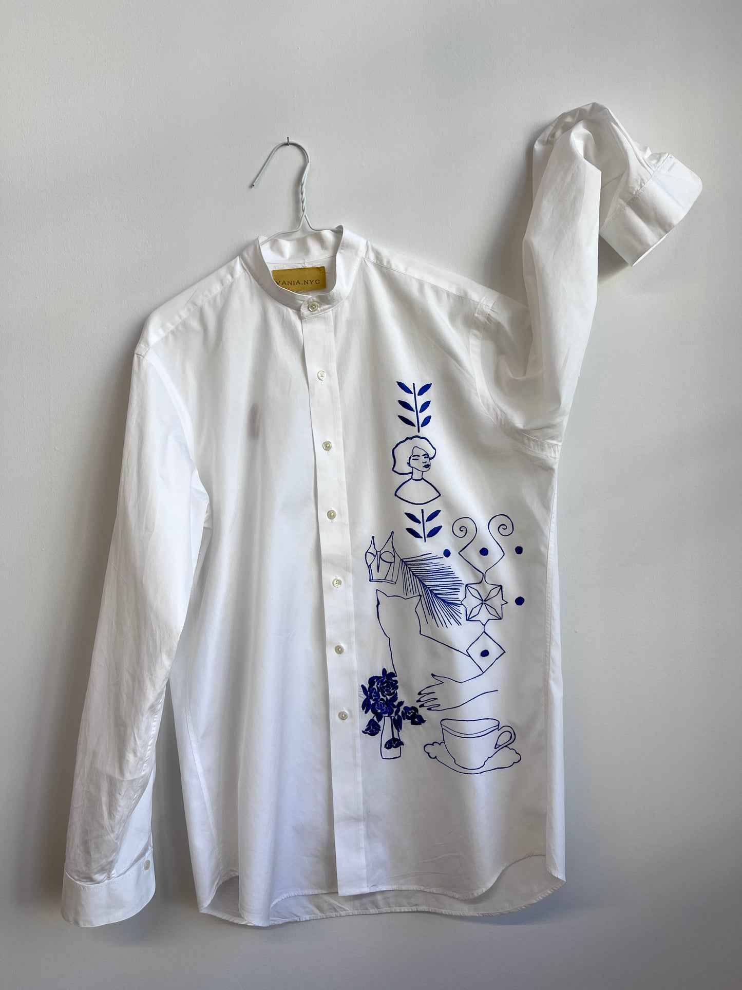 Her Universe in Blue embroidered on a white shirt