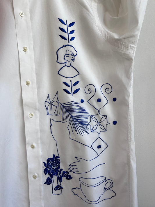 Her Universe in Blue embroidered on a white shirt