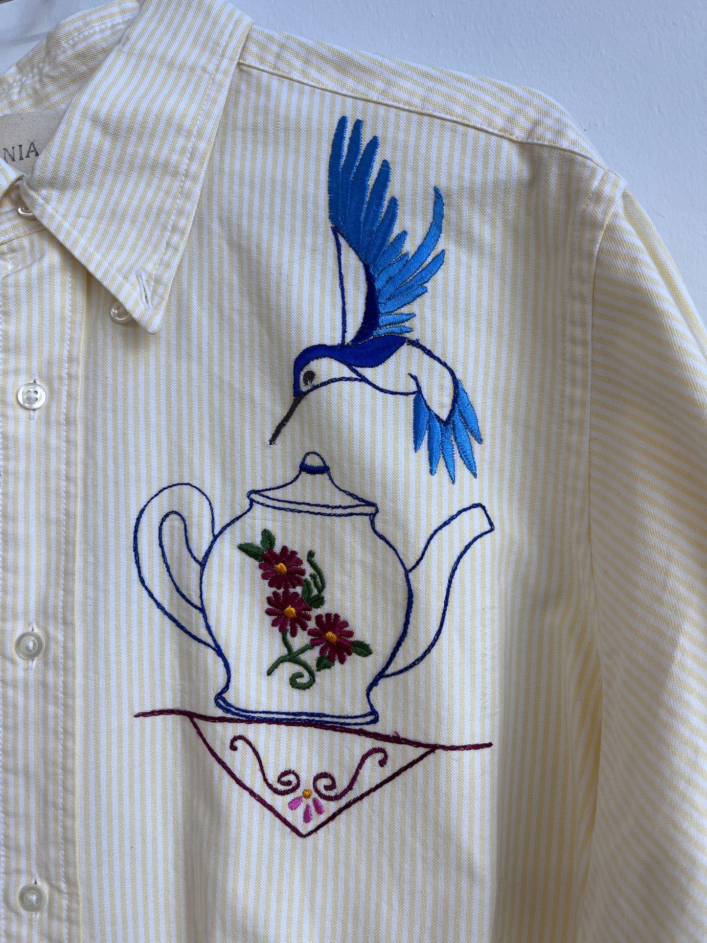 Hummingbird and a tea pot