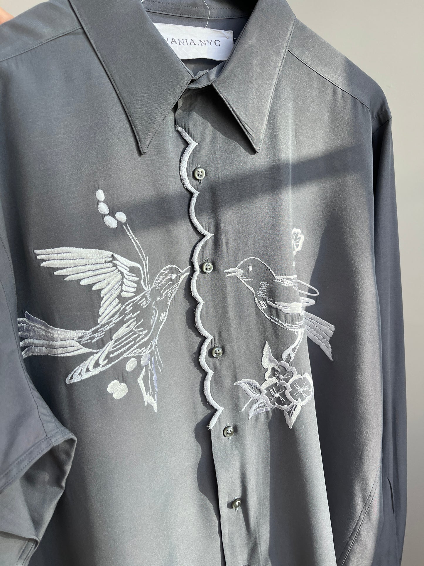 White birds and a scalloped center Gray Shirt