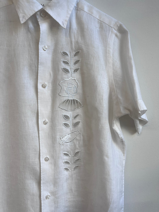 Cut work embroidery on a white linen shirt