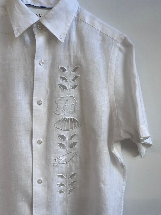 Cut work embroidery on a white linen shirt